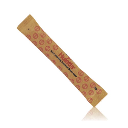 Huletts 5g brown sugar sticks individually wrapped for hospitality tea and coffee service.